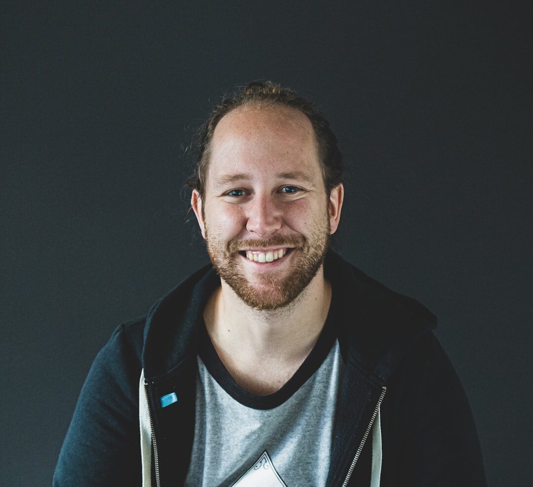 Professional man in business casual attire smiling