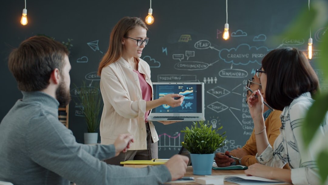 Team of people collaborating around a table in a modern office