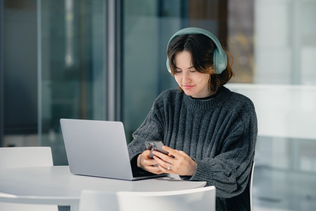 woman with headphones reading