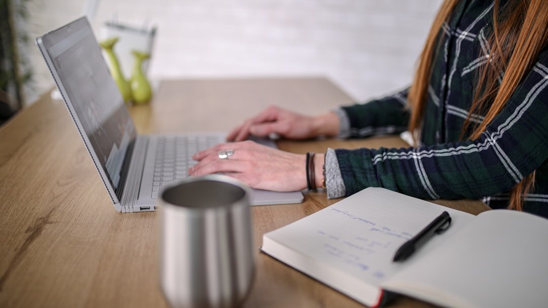woman editing text on laptop