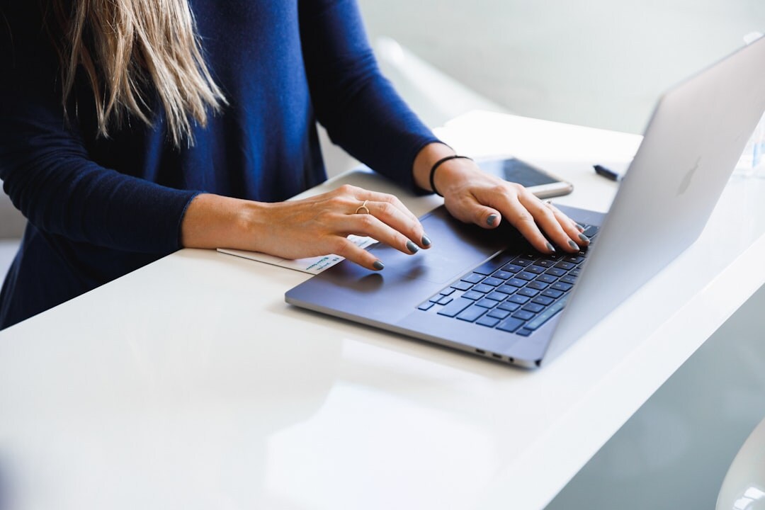 person reading transcript on laptop