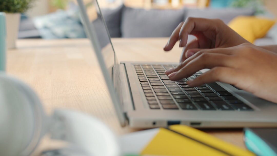person typing on laptop
