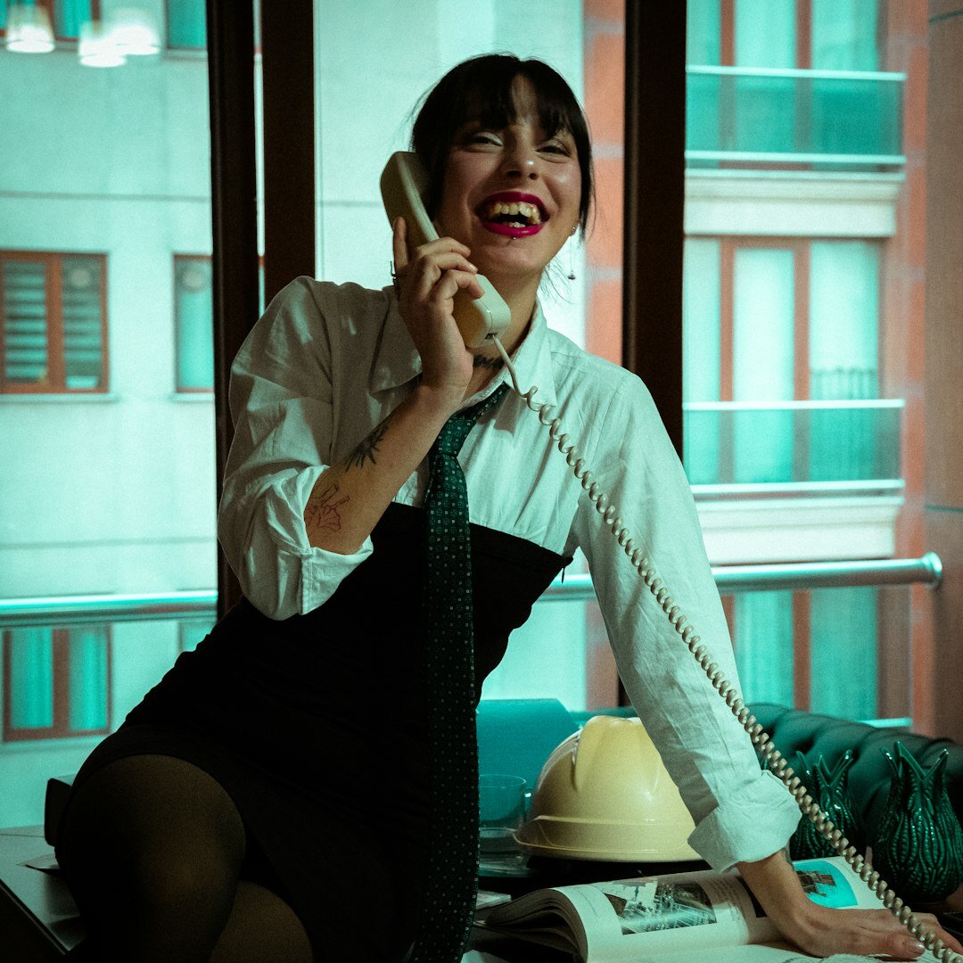 Professional woman with dark hair smiling in office